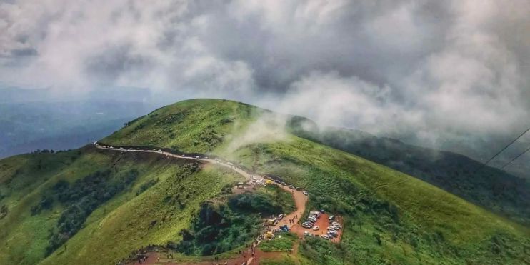 Scenic mountain landscape with a winding road on top, showcasing the beauty of nature and travel.