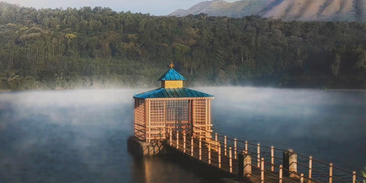 Scenic wooden pier on Hirekolale Lake in Chikmagalur, perfect spot to start a peaceful trip.