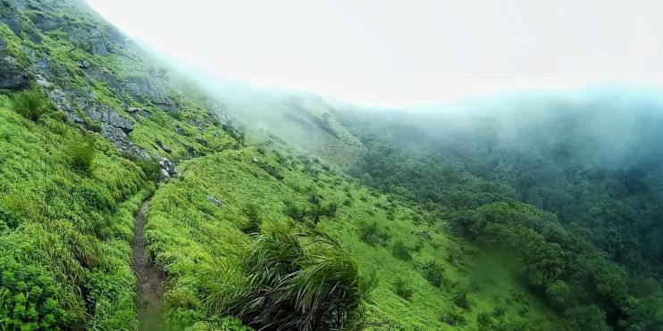 A lush green mountain in Chikmagalur district, Karnataka, easily accessible by road, rail, or air. Detailed travel guide included.