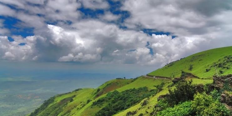 A breathtaking mountain view with clouds, capturing the serene beauty of nature and the tranquility of the surrounding landscape.