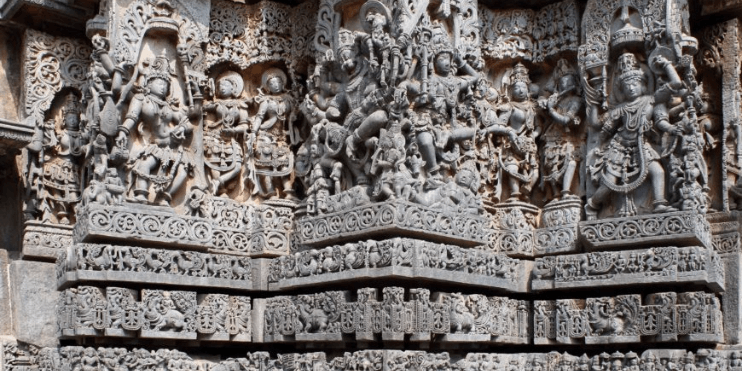 Intricate carvings on temple walls showcase scenes from mythology and daily life, reflecting Hoysala's rich cultural heritage.