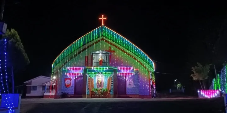 A church adorned with vibrant lights, celebrating the festive spirit of Christmas in the local community. 