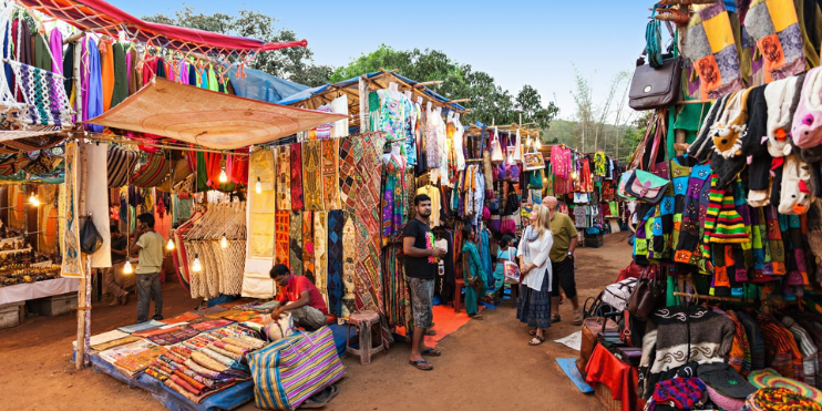 A bustling market filled with a variety of colorful goods, ideal for holiday shopping and celebrating the festive spirit.