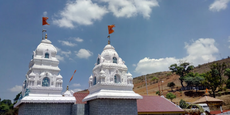 A white temple featuring two prominent towers, symbolizing peace and spiritual rejuvenation for its visitors.